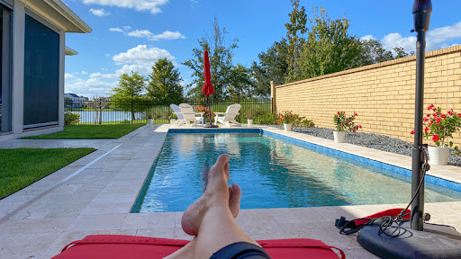 pool owner enjoys pool that has less energy use with a heat pump